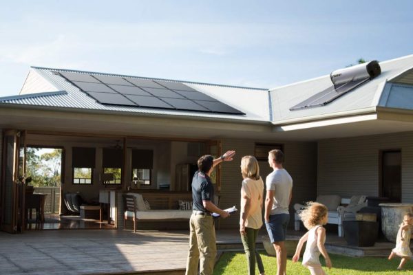 Solahart Installer and home owners discussing Solarpanels